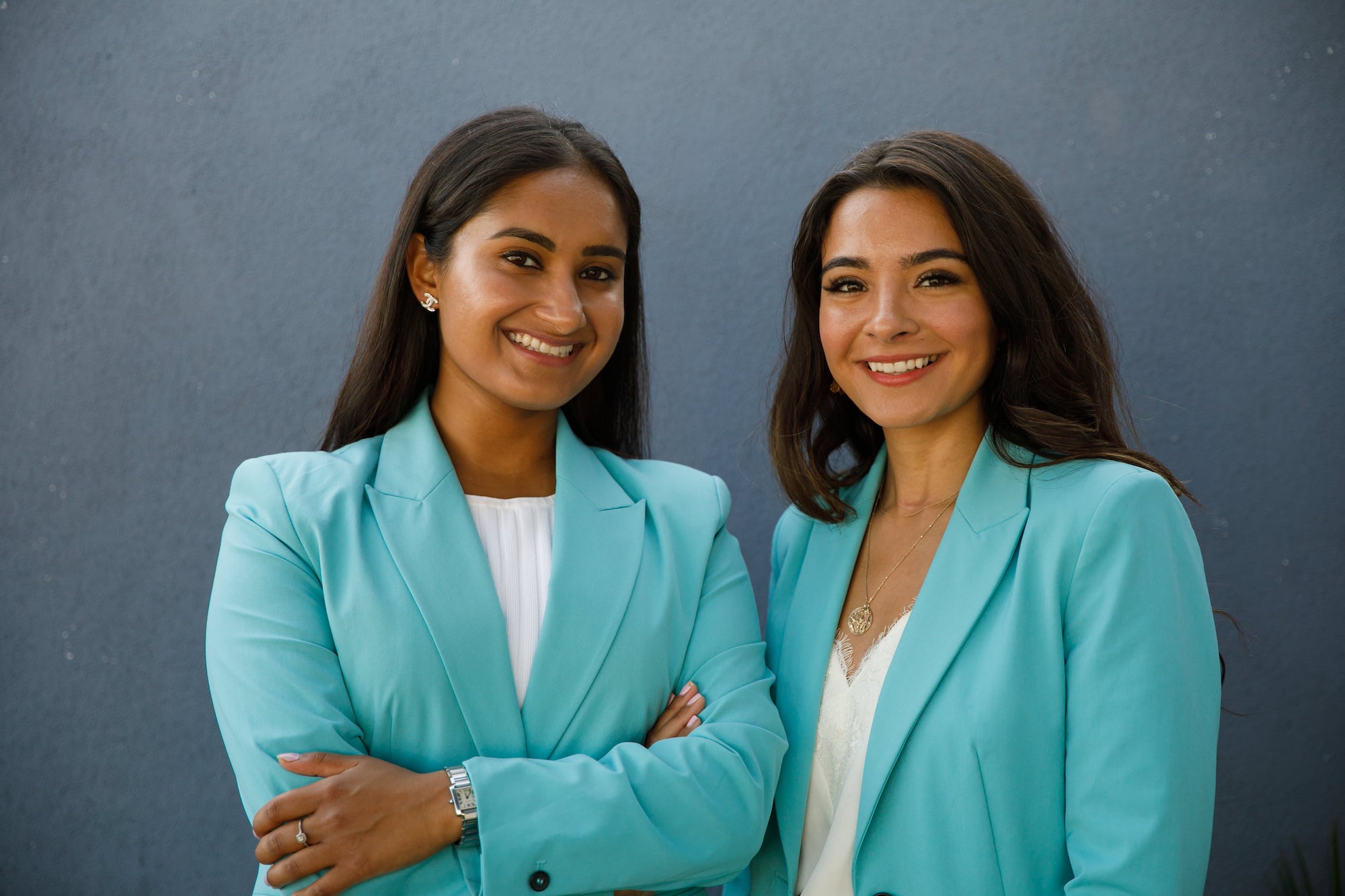 Ahva and Nikita in teal suits